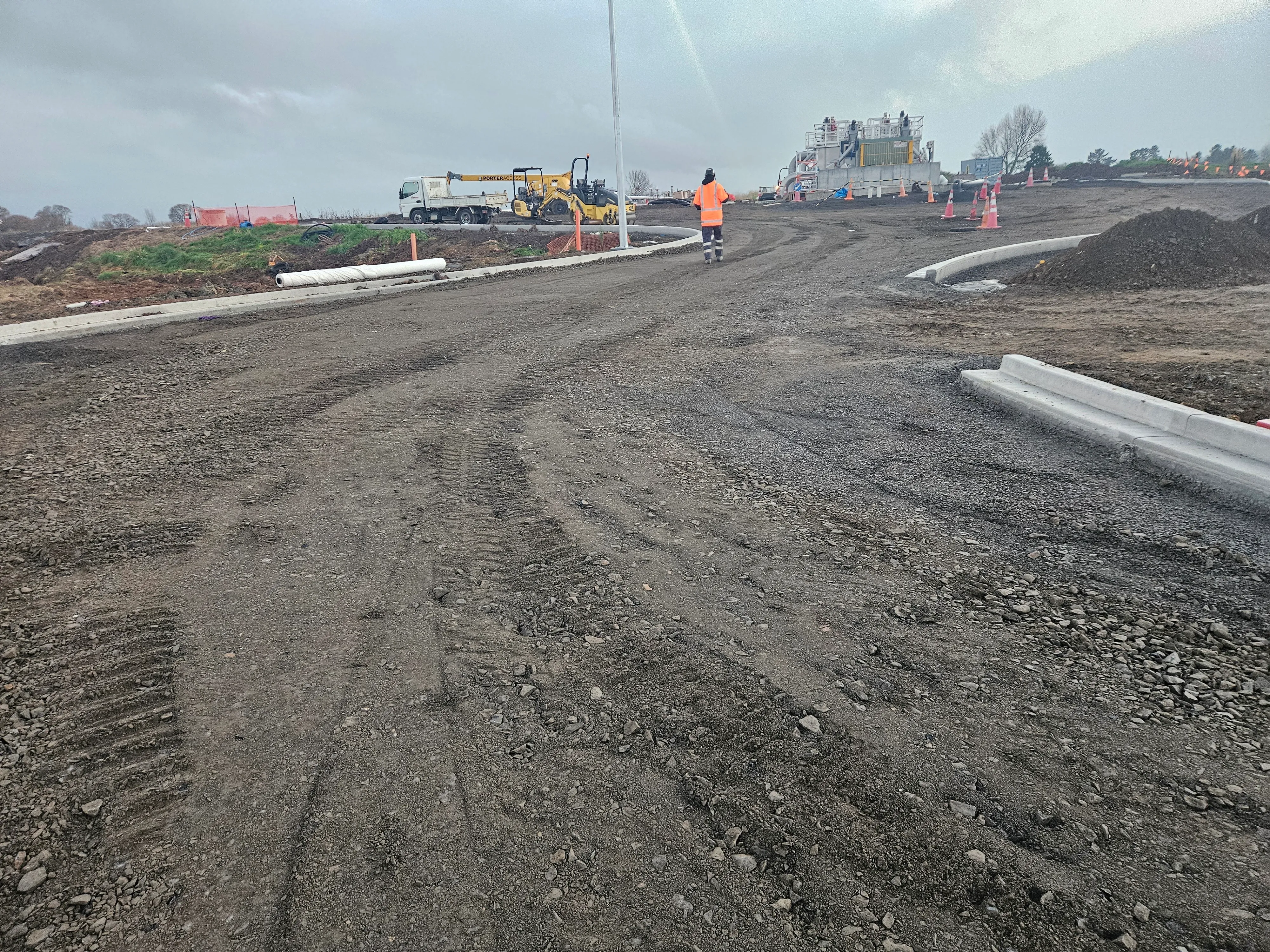 Freshly built subdivision road with new kerbs and compacted basecourse